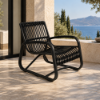 Fotografia e Karrige lounge, prado, alumin bronz, ratan i zi, 66.5x67x88.5cm.